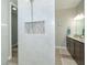 Bathroom with walk-in shower, double vanity, and granite countertop at 226 Rotonda N Blvd, Rotonda West, FL 33947