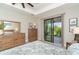 Main bedroom with sliding glass doors to backyard at 226 Rotonda N Blvd, Rotonda West, FL 33947
