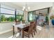 Charming dining room with a table for four, overlooking a relaxing patio at 226 Rotonda N Blvd, Rotonda West, FL 33947
