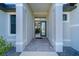 Front entry with tile flooring and glass door at 226 Rotonda N Blvd, Rotonda West, FL 33947