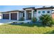 Front view of house with walkway and landscaping at 226 Rotonda N Blvd, Rotonda West, FL 33947