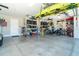 Organized garage with ceiling storage, and space for motorcycles and bikes at 226 Rotonda N Blvd, Rotonda West, FL 33947