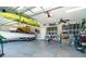 Spacious garage with overhead storage, and room for vehicles and watercraft at 226 Rotonda N Blvd, Rotonda West, FL 33947