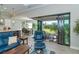Living room with sliding doors opening to patio at 226 Rotonda N Blvd, Rotonda West, FL 33947
