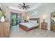 Spacious main bedroom with wood furniture and sliding doors to patio at 226 Rotonda N Blvd, Rotonda West, FL 33947