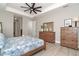 Bright main bedroom with wood furniture and access to hallway at 226 Rotonda N Blvd, Rotonda West, FL 33947