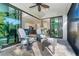 Enjoy this screened patio, complete with comfortable seating and ceiling fans at 226 Rotonda N Blvd, Rotonda West, FL 33947