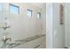 Large walk-in shower with built-in bench and pebble floor at 226 Rotonda N Blvd, Rotonda West, FL 33947