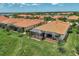 Aerial view of villas with screened lanais and conservation area views at 24028 Canterwood Way, Venice, FL 34293