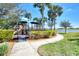 playground with play structures near a lake at 24028 Canterwood Way, Venice, FL 34293