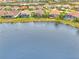 Bird's-eye view of lakefront community with luxurious homes and pools at 26837 Weiskopf Dr, Englewood, FL 34223