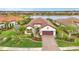 Luxury home with landscaped yard and lake view in a desirable community at 26837 Weiskopf Dr, Englewood, FL 34223