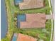Bird's-eye view of a waterfront home with a pool and spacious yard at 26837 Weiskopf Dr, Englewood, FL 34223