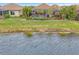 Luxury home with pool and lush landscaping backing up to a canal at 26837 Weiskopf Dr, Englewood, FL 34223