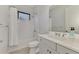 Clean bathroom, featuring a shower/tub combo and gray vanity at 26837 Weiskopf Dr, Englewood, FL 34223