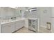 Double vanity bathroom with a large walk-in shower at 26837 Weiskopf Dr, Englewood, FL 34223