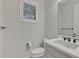 Simple half bathroom with a pedestal sink and white toilet at 26837 Weiskopf Dr, Englewood, FL 34223