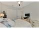 Relaxing bedroom with a TV and plenty of closet space at 26837 Weiskopf Dr, Englewood, FL 34223