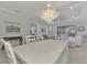 Open concept dining room with a view of the backyard and pool at 26837 Weiskopf Dr, Englewood, FL 34223