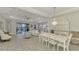 Open dining room with view of living room and pool at 26837 Weiskopf Dr, Englewood, FL 34223
