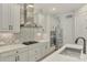 Modern kitchen with stainless steel appliances and herringbone backsplash at 26837 Weiskopf Dr, Englewood, FL 34223