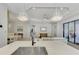 Island kitchen with marble countertops and a view of the living room at 26837 Weiskopf Dr, Englewood, FL 34223