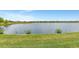 Scenic view of a peaceful lake and community homes at 26837 Weiskopf Dr, Englewood, FL 34223