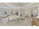 Spacious living area showcasing an open floor plan with kitchen views at 26837 Weiskopf Dr, Englewood, FL 34223
