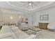 Open living room features a white couch, dining area, and hardwood floors at 26837 Weiskopf Dr, Englewood, FL 34223