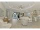 Spacious living area with pool view and open kitchen at 26837 Weiskopf Dr, Englewood, FL 34223