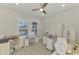 Bright home office with built-in cabinetry and hardwood floors at 26837 Weiskopf Dr, Englewood, FL 34223