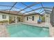 Relaxing pool and patio with covered lanai, offering a resort-style feel at 26837 Weiskopf Dr, Englewood, FL 34223