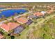 Luxury homes surround a lake in a peaceful community at 2744 Mill Creek Rd, Port Charlotte, FL 33953