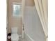Clean bathroom with a toilet and a bathtub at 2744 Mill Creek Rd, Port Charlotte, FL 33953