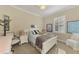 Cozy bedroom with a queen bed and plenty of natural light at 2744 Mill Creek Rd, Port Charlotte, FL 33953