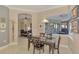 Kitchen breakfast nook with a table and chairs, overlooking the pool at 2744 Mill Creek Rd, Port Charlotte, FL 33953