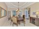 Formal dining room with a large wooden table and chandelier at 2744 Mill Creek Rd, Port Charlotte, FL 33953