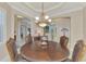 Bright dining room featuring a round table and comfortable seating for six at 2744 Mill Creek Rd, Port Charlotte, FL 33953