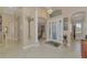 Grand entryway with high ceilings, tile floors, and an abundance of natural light at 2744 Mill Creek Rd, Port Charlotte, FL 33953