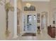 Elegant entryway with decorative columns and a large glass front door at 2744 Mill Creek Rd, Port Charlotte, FL 33953