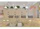 Kitchen features granite counters, double sink and pendant lighting at 2744 Mill Creek Rd, Port Charlotte, FL 33953