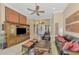 Elegant living room featuring a large TV and comfortable leather seating at 2744 Mill Creek Rd, Port Charlotte, FL 33953
