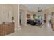 Open living space with leather furniture, tiled floors, and access to the backyard at 2744 Mill Creek Rd, Port Charlotte, FL 33953