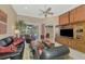 Spacious living room with leather furniture and a large entertainment center at 2744 Mill Creek Rd, Port Charlotte, FL 33953