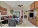 Living room with leather sofas, a large TV, and access to the pool area at 2744 Mill Creek Rd, Port Charlotte, FL 33953
