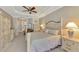 Spacious main bedroom with large armoire and ceiling fan at 2744 Mill Creek Rd, Port Charlotte, FL 33953