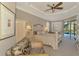 Main bedroom with pool view and seating area at 2744 Mill Creek Rd, Port Charlotte, FL 33953