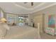 Main bedroom with pool access and ceiling fan at 2744 Mill Creek Rd, Port Charlotte, FL 33953
