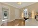 Home office with hardwood floors and access to outdoor patio at 2744 Mill Creek Rd, Port Charlotte, FL 33953