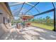 Expansive patio with covered lanai, comfortable seating, and tranquil views at 2744 Mill Creek Rd, Port Charlotte, FL 33953